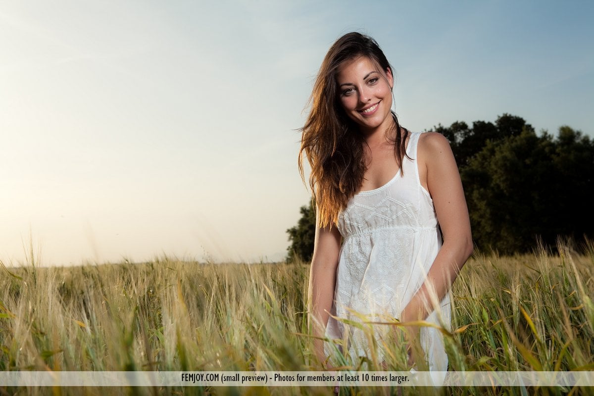 Lorena G in A Field With A Flower photo 1 of 16